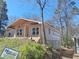 Exterior view of the new home construction, featuring light siding and a covered porch at 110 Dahlia Nw Ave, Atlanta, GA 30314