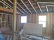 Framing of a new room, revealing unfinished walls and windows at 110 Dahlia Nw Ave, Atlanta, GA 30314