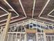 Looking up at the exposed ceiling and beams of the home during renovation at 110 Dahlia Nw Ave, Atlanta, GA 30314