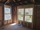 A view of the framed room interior with rough window installations at 110 Dahlia Nw Ave, Atlanta, GA 30314