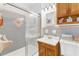Updated bathroom with shower and storage at 1868 Fort Valley Sw Dr, Atlanta, GA 30311