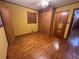 Bedroom with hardwood flooring, built in shelves, and natural lighting at 1868 Fort Valley Sw Dr, Atlanta, GA 30311