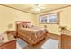 Cozy bedroom with a plush bed, side tables, and a bright window at 1868 Fort Valley Sw Dr, Atlanta, GA 30311