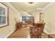 Elegant dining room showcasing wood flooring, crown molding, natural light and classic décor at 1868 Fort Valley Sw Dr, Atlanta, GA 30311