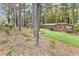 Charming brick home surrounded by mature trees and landscaping offers a serene and private setting at 1868 Fort Valley Sw Dr, Atlanta, GA 30311