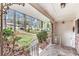 Inviting front porch with decorative iron railings, stone flooring, and views of the landscaped yard at 1868 Fort Valley Sw Dr, Atlanta, GA 30311