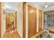 Inviting hallway with hardwood floors, natural light, and access to other rooms in the house at 1868 Fort Valley Sw Dr, Atlanta, GA 30311