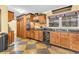 Well-equipped kitchen featuring wooden cabinetry, modern appliances, and ample countertop space at 1868 Fort Valley Sw Dr, Atlanta, GA 30311