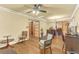 Sunlit living room with hardwood floors, decorative molding, and double glass doors at 1868 Fort Valley Sw Dr, Atlanta, GA 30311
