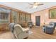 Cozy sunroom offering relaxing chairs, views of the outdoor space, and natural lighting at 1868 Fort Valley Sw Dr, Atlanta, GA 30311