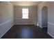 Formal dining room with hardwood floors, neutral paint, and a contemporary chandelier at 233 Bloomfield Cir, Canton, GA 30114