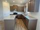 Modern kitchen features stainless appliances, granite countertops, and center island at 233 Bloomfield Cir, Canton, GA 30114