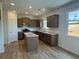 Modern kitchen features stainless appliances, granite countertops, and center island at 233 Bloomfield Cir, Canton, GA 30114