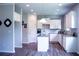 Modern kitchen featuring white cabinets, granite countertops, and a stylish center island at 233 Bloomfield Cir, Canton, GA 30114