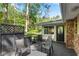 Relax on the deck adjacent to the house, offering chairs, greenery and access to the home's interior at 2799 Briarglen Dr, Atlanta, GA 30340