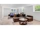 Finished basement with tile flooring, sofa, and bedroom area at 2799 Briarglen Dr, Atlanta, GA 30340