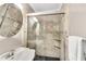 Modern bathroom with a tiled shower, black tile floor, and new fixtures at 2799 Briarglen Dr, Atlanta, GA 30340