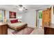 Comfortable bedroom with a ceiling fan, natural light, and hardwood door at 2799 Briarglen Dr, Atlanta, GA 30340