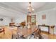 Elegant dining room with an open floor plan connected to the living room, showcasing hardwood floors at 2799 Briarglen Dr, Atlanta, GA 30340