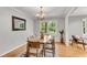 Charming dining room featuring a classic chandelier, hardwood floors, and natural light at 2799 Briarglen Dr, Atlanta, GA 30340