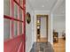 View of the home's foyer showing the unique flooring and front door with glass panels at 2799 Briarglen Dr, Atlanta, GA 30340