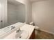 Comfortable bathroom featuring a single vanity and combined tub and shower at 55 Ratliff Dr, Covington, GA 30016