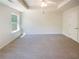 Bright bedroom with trey ceilings and a ceiling fan at 55 Ratliff Dr, Covington, GA 30016