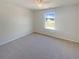 Bright bedroom with a ceiling fan and a view from the single window at 55 Ratliff Dr, Covington, GA 30016
