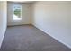 The bedroom offers great sunlight through a large window at 55 Ratliff Dr, Covington, GA 30016