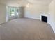 Bright living room with large windows, a fireplace, and neutral decor at 55 Ratliff Dr, Covington, GA 30016