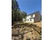 Large backyard with freshly laid grass and a view of the home's exterior at 6108 Marigold Way, Atlanta, GA 30349