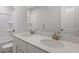 Bright bathroom featuring double sinks, a toilet, and a tub-shower combination at 6108 Marigold Way, Atlanta, GA 30349