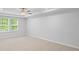 Spacious bedroom featuring carpet and a large window at 6108 Marigold Way, Atlanta, GA 30349