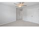 Bedroom featuring a ceiling fan, plush carpet, and a closet at 6108 Marigold Way, Atlanta, GA 30349