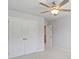 Bright bedroom with carpet, neutral walls, ceiling fan, and closet at 6108 Marigold Way, Atlanta, GA 30349