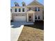 Charming brick and siding two-story home with a welcoming front porch and two car garage at 6108 Marigold Way, Atlanta, GA 30349