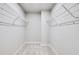 Spacious walk-in closet with carpeted floor and wire shelving for storage at 6108 Marigold Way, Atlanta, GA 30349