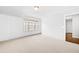 Bright bedroom with neutral carpet, freshly painted white walls, and large window at 667 Creswell Park, Smyrna, GA 30082