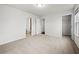 Bright bedroom with neutral carpet, featuring a walk-in closet and en suite bathroom at 667 Creswell Park, Smyrna, GA 30082