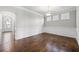 Dining room with gorgeous trim work, hardwood floors, and three windows for great natural light at 667 Creswell Park, Smyrna, GA 30082