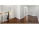 Upstairs hallway landing with hardwood floors and view of staircase at 667 Creswell Park, Smyrna, GA 30082
