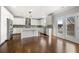 Kitchen features a large center island, stainless steel appliances, and white shaker cabinets at 667 Creswell Park, Smyrna, GA 30082