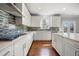 Bright kitchen features sleek countertops, tile backsplash, and modern appliances at 667 Creswell Park, Smyrna, GA 30082