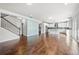 Spacious living room featuring hardwood floors and an open layout into the kitchen at 667 Creswell Park, Smyrna, GA 30082