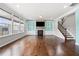 Bright living room with built-in shelving, a cozy fireplace, and large windows at 667 Creswell Park, Smyrna, GA 30082