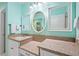 Well-lit bathroom features a double vanity with granite countertops and stylish fixtures at 1817 Bedfordshire Dr, Decatur, GA 30033