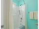 Bright bathroom with a tiled shower/bathtub combination and bead board accents at 1817 Bedfordshire Dr, Decatur, GA 30033