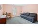 Spacious bedroom with comfortable furniture, large window, and neutral carpet at 1817 Bedfordshire Dr, Decatur, GA 30033