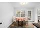 Cozy breakfast nook with slate flooring, a table with chairs, and natural light from the windows at 1817 Bedfordshire Dr, Decatur, GA 30033