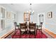 Elegant dining room featuring hardwood floors, a chandelier, and ample natural light at 1817 Bedfordshire Dr, Decatur, GA 30033